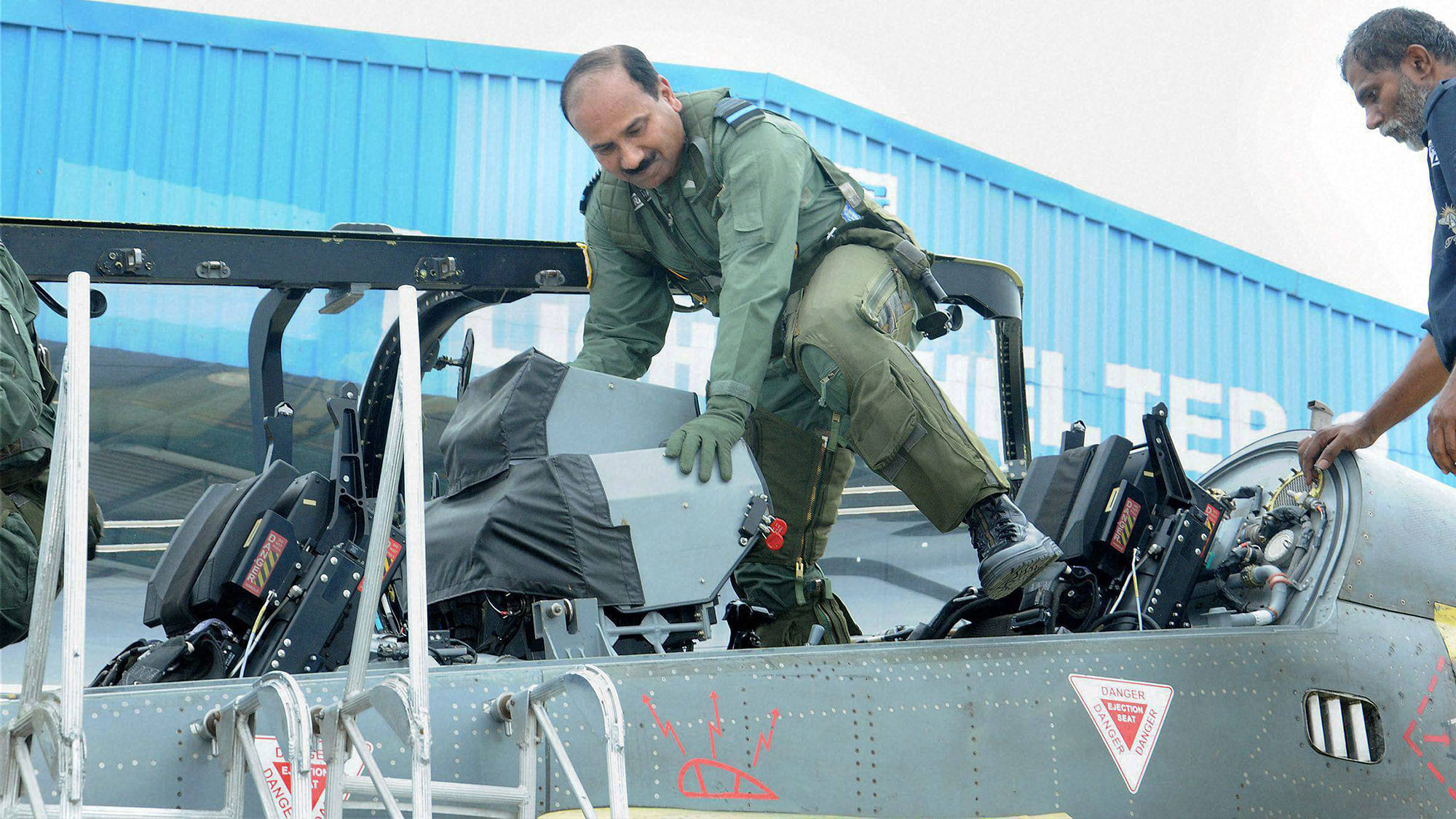 Chief of Air Staff Air Chief Marshal Arup Raha getting down from Light Combat Aircraft (Tejas) after a sortie at HAL Bengaluru on Tuesday. (Photo: PTI)