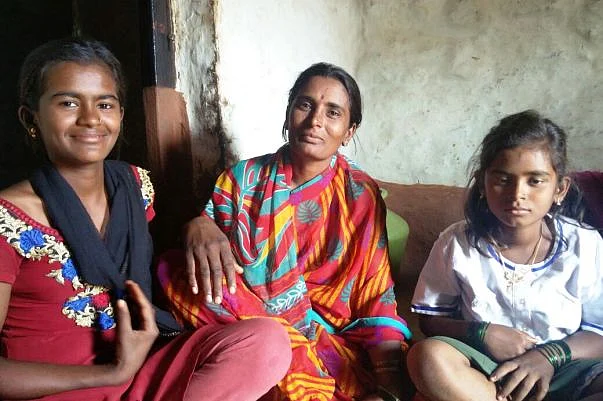 Chaithi (in white) with her mother and sister. (Photo: <i>The News Minute</i>)