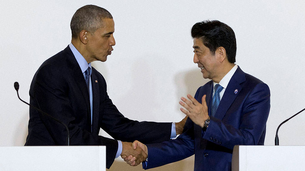 President Barack Obama and Japanese Prime Minister Shinzo Abe shake hands after speaking to media in Shima, Japan, 25 May 2016. (Photo: PTI)