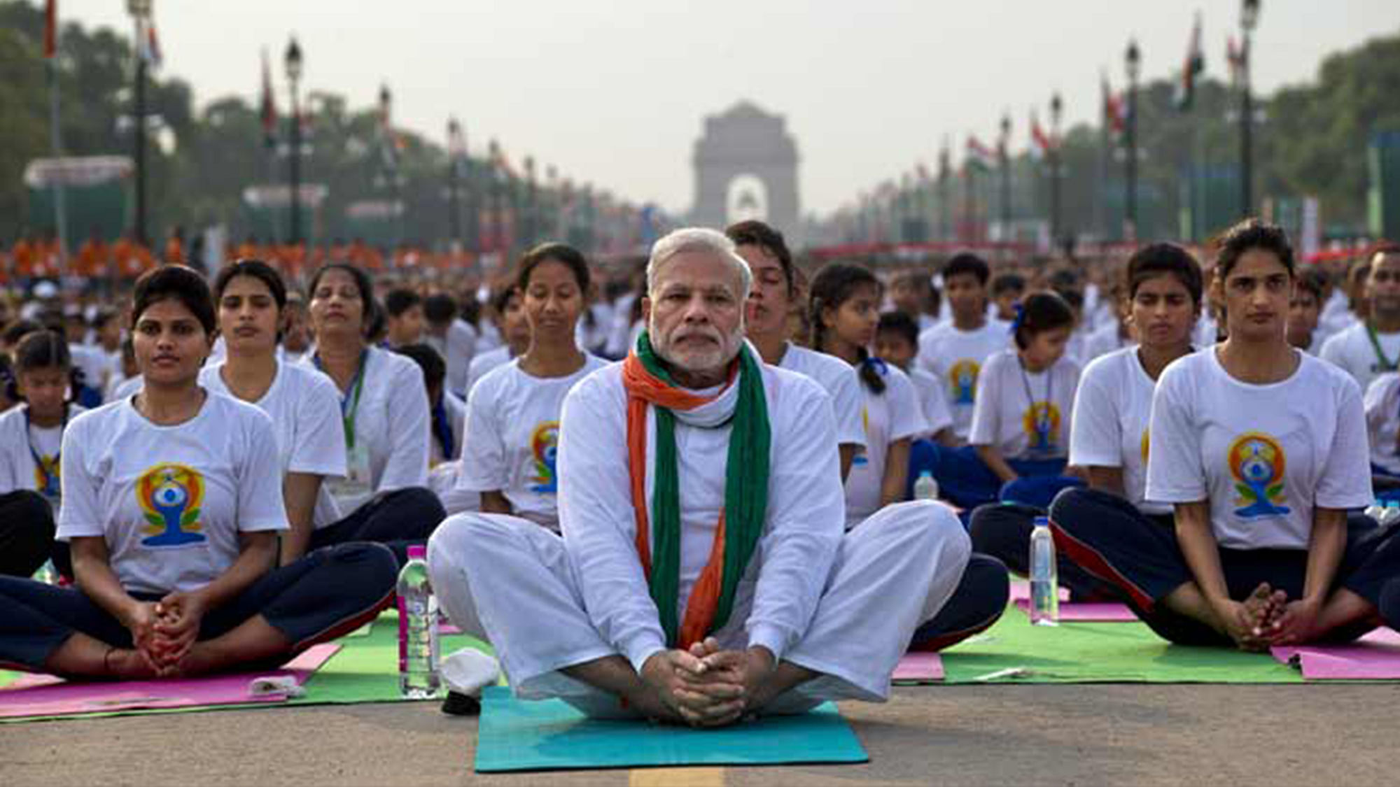 Prime Minister Narendra Modi, (centre), performing yoga along with thousands of Indians on Rajpath, in New Delhi, India, Sunday, June 21, 2015. (Photo: PTI)