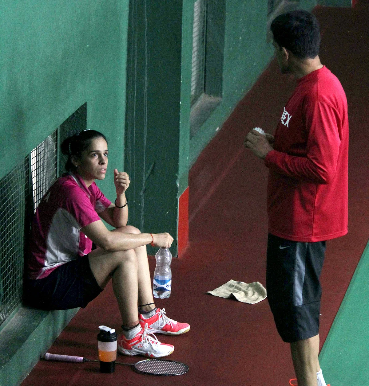 Saina Nehwal with coach Vimal Kumar at a training session in Bangalore in July 2015. (Photo: IANS)