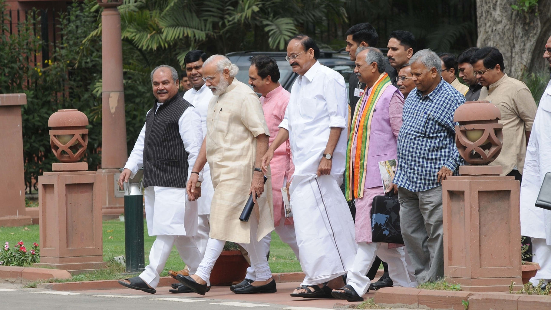 Prime Minister Narendra Modi with cabinet members and others outside the Parliament. (Photo: IANS)