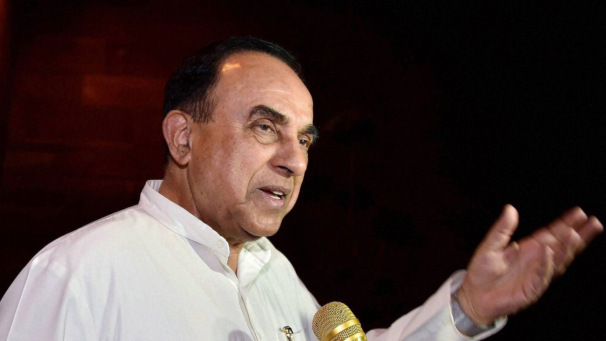 Subramanian Swamy talks to the media at Parliament House in New Delhi.&nbsp;