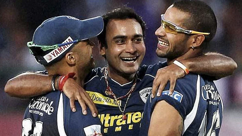 Amit Mishra celebrates the hat-trick with his teammates. 