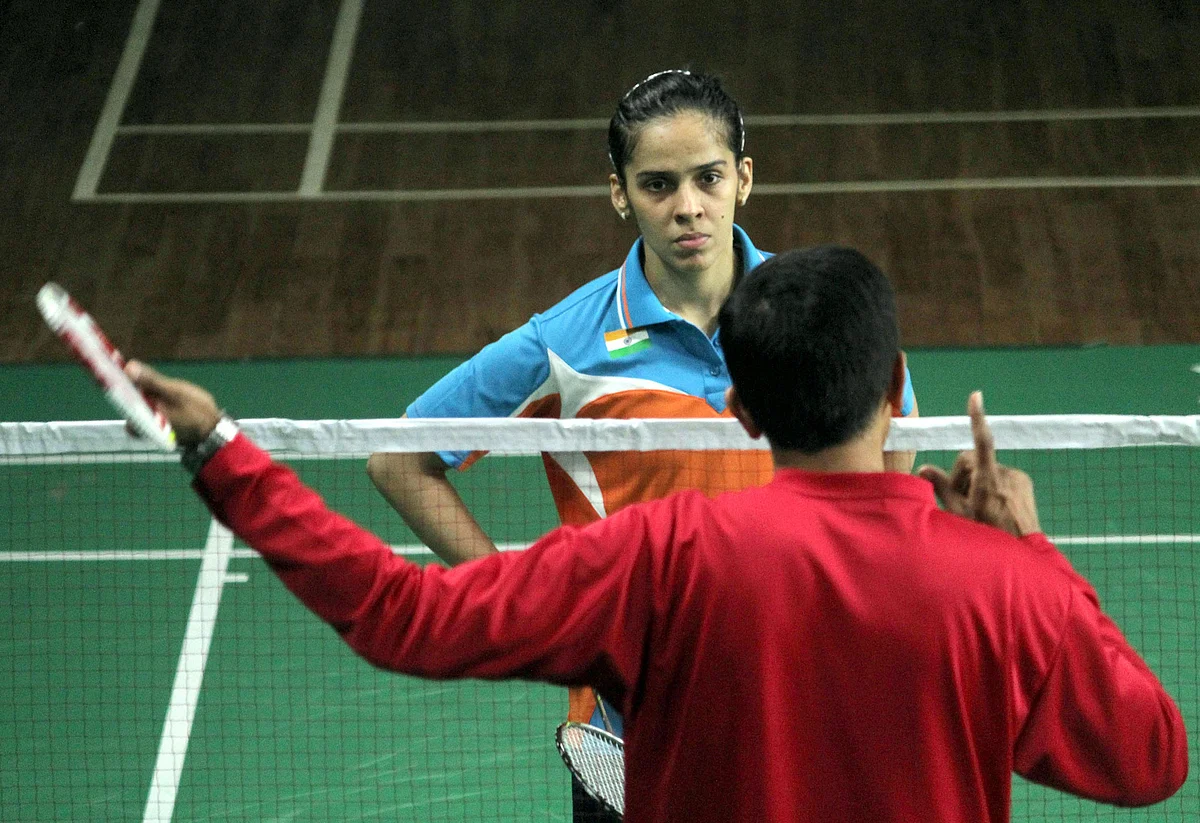 Saina Nehwal with coach Vimal Kumar at a training session in Bangalore in July 2015. (Photo: IANS)