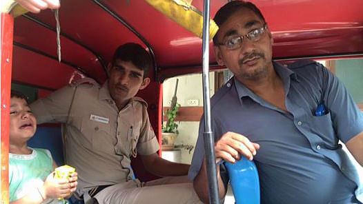 Constable Dharmendra and the auto driver who took a lost child to the parents. (Photo Courtesy: Facebook Malvinder Rikhy)