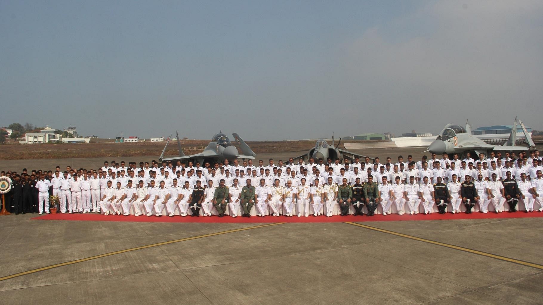 The outgoing Sea Harriers flanked by the newly inducted MiG 29K fighters of Indian Navy during the de-induction of Sea Harriers and Induction of the MiG 29K in Dabolim, Goa on 11 May 2016. (Photo: IANS)