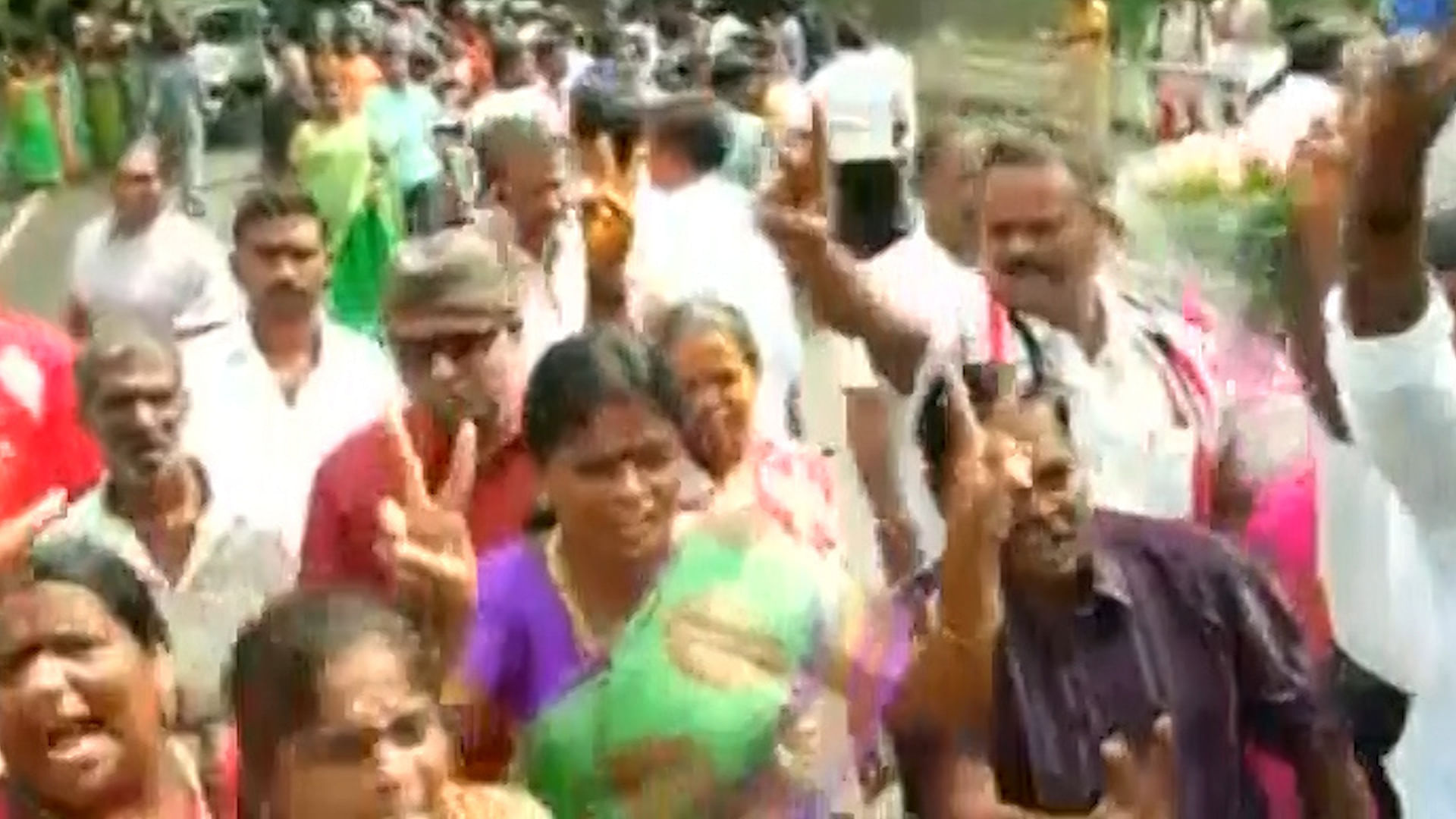 AIADMK supporters broke out into celebrations outside AIADMK chief J Jayalalithaa’s Poes Garden residence. (Photo: ANI screengrab)