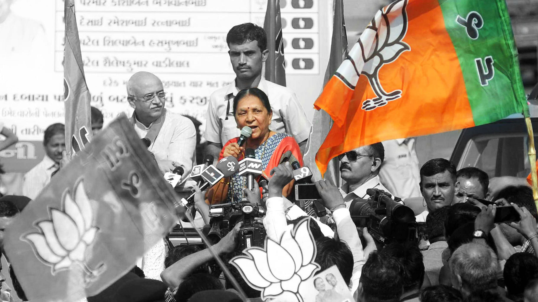 Gujarat Chief Minister Anandiben Patel at a road show in Ahmedabad on 17 November 2015. (Photo: IANS/ Altered by <b>The Quint</b>)
