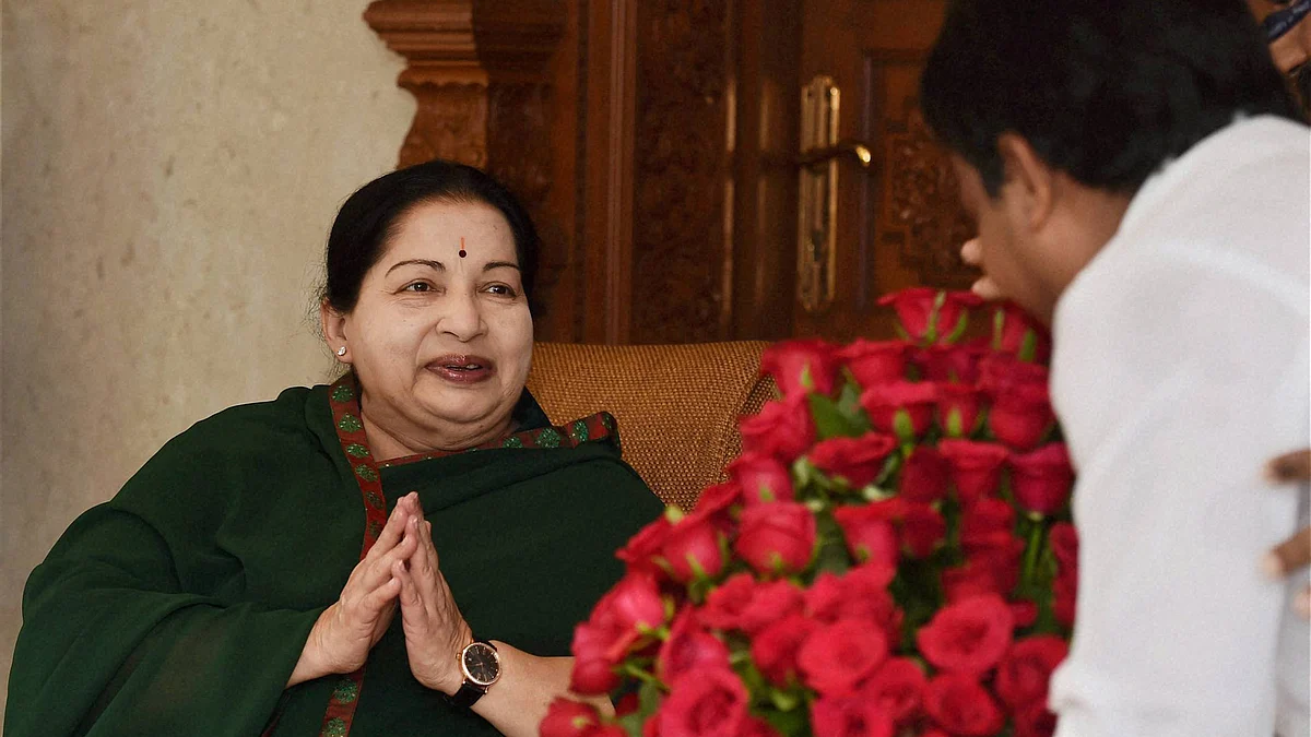 Tamil Nadu Chief Minister and AIADMK Supremo J Jayalalithaa is greeted by a party cadre after the party’s win in the state Assembly polls, in Chennai on Thursday. (Photo: PTI)
