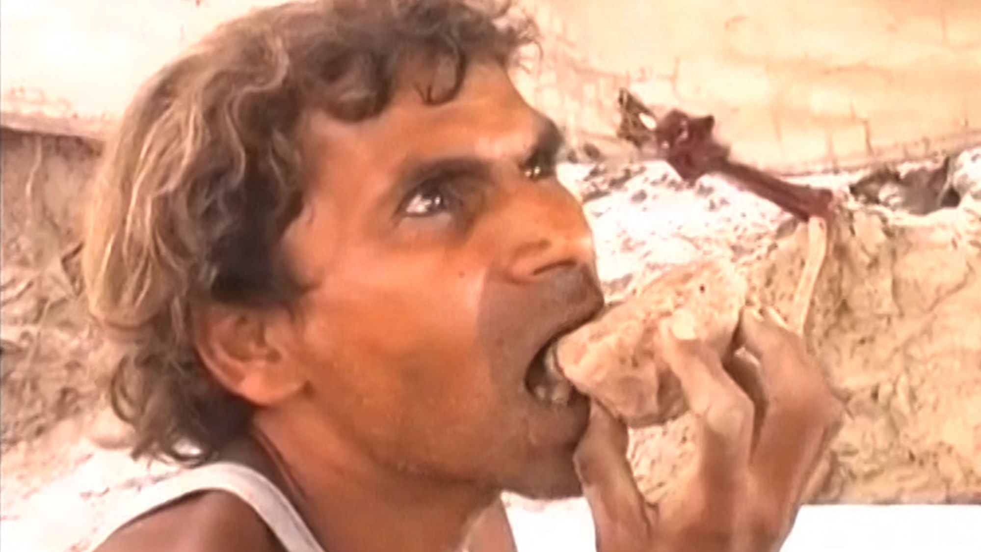 Rameshwar from Haridwar, Uttarakhand is somewhat of a local celebrity because of his habit of eating mud and stones. (Photo: ANI Screengrab)