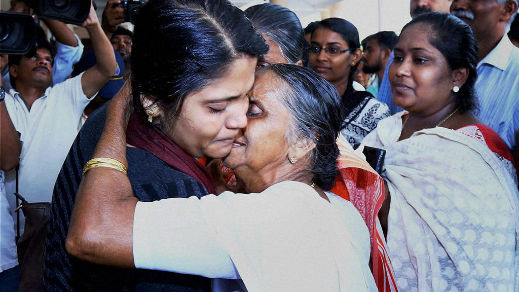 The first batch of 18 Keralites, evacuated from Libya, uniting with their families and friends on their arrival at Kochi International Airport on Thursday. (Photo: PTI)