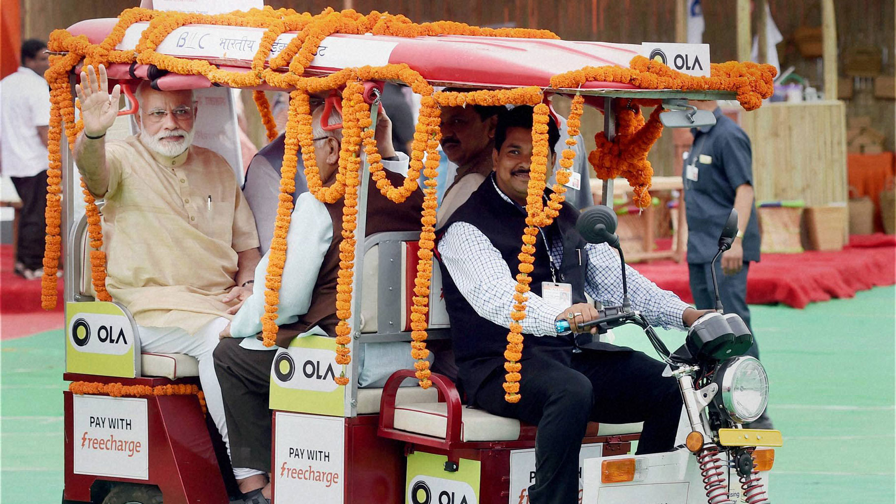  PM Narendra Modi in Ola’s e-rickshaw. (Photo: PTI)