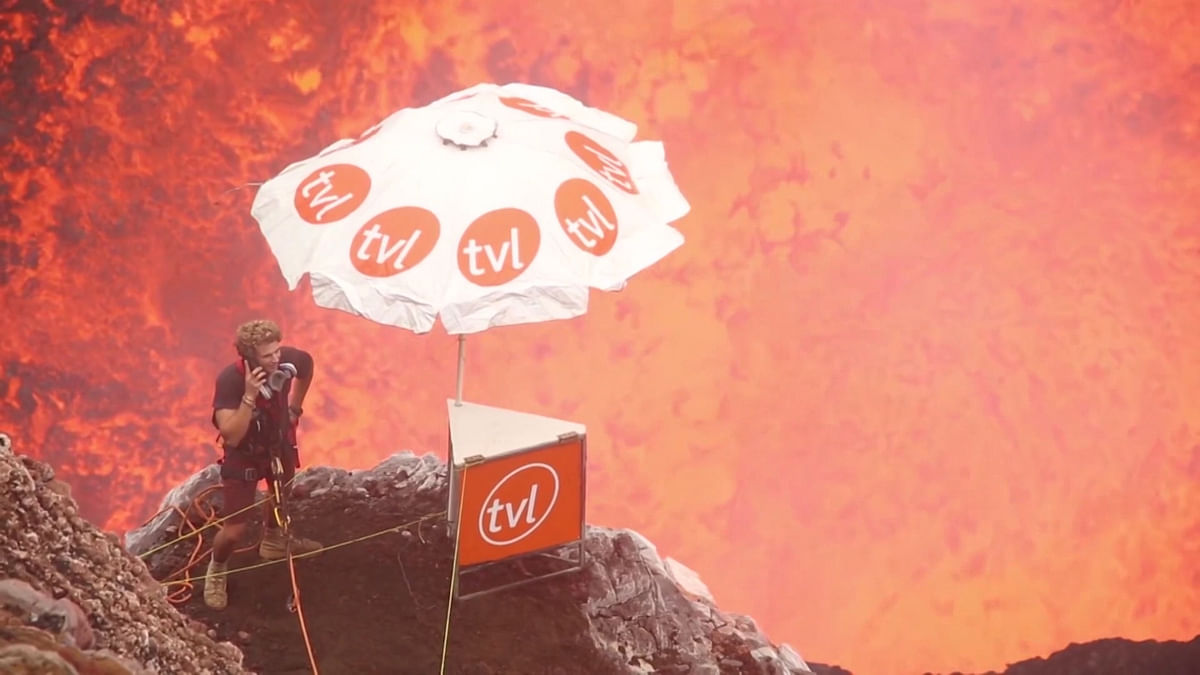 Man Stands On the Edge Of a Volcano... to Take a Call!
