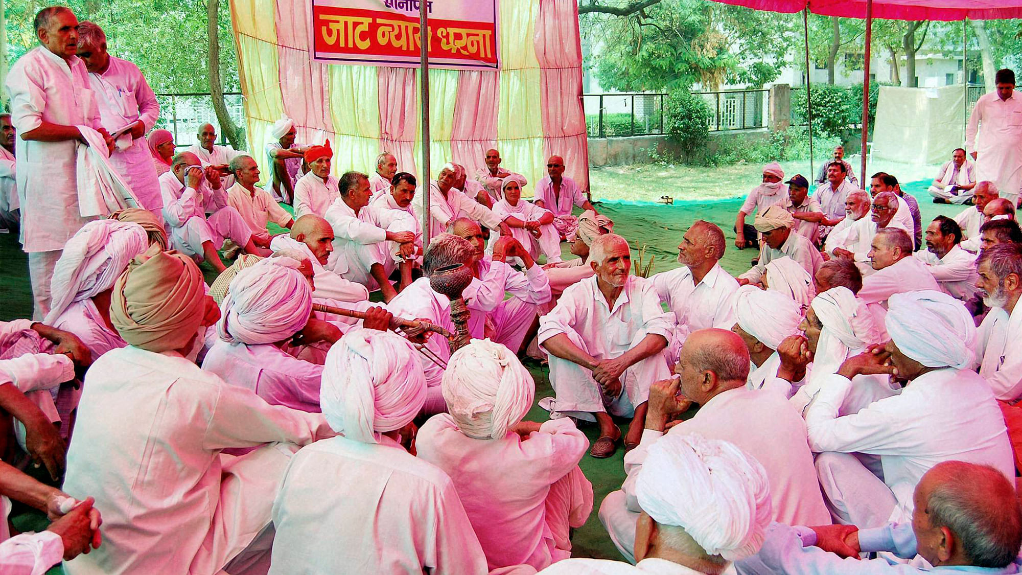 Jat members holding a dharna for reservation in Sonipat on Sunday. (Photo: PTI)
