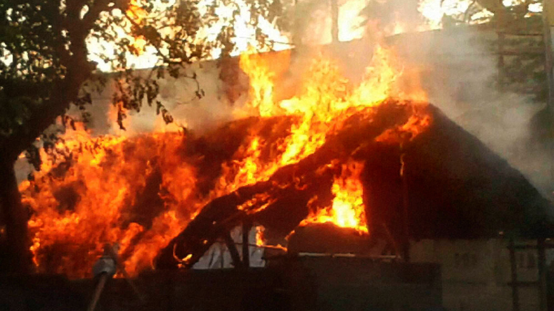 A house is set on fire after clashes between the police and the encroachers who were being evicted from Jawahar bagh in Mathura on Thursday. (Photo: PTI)