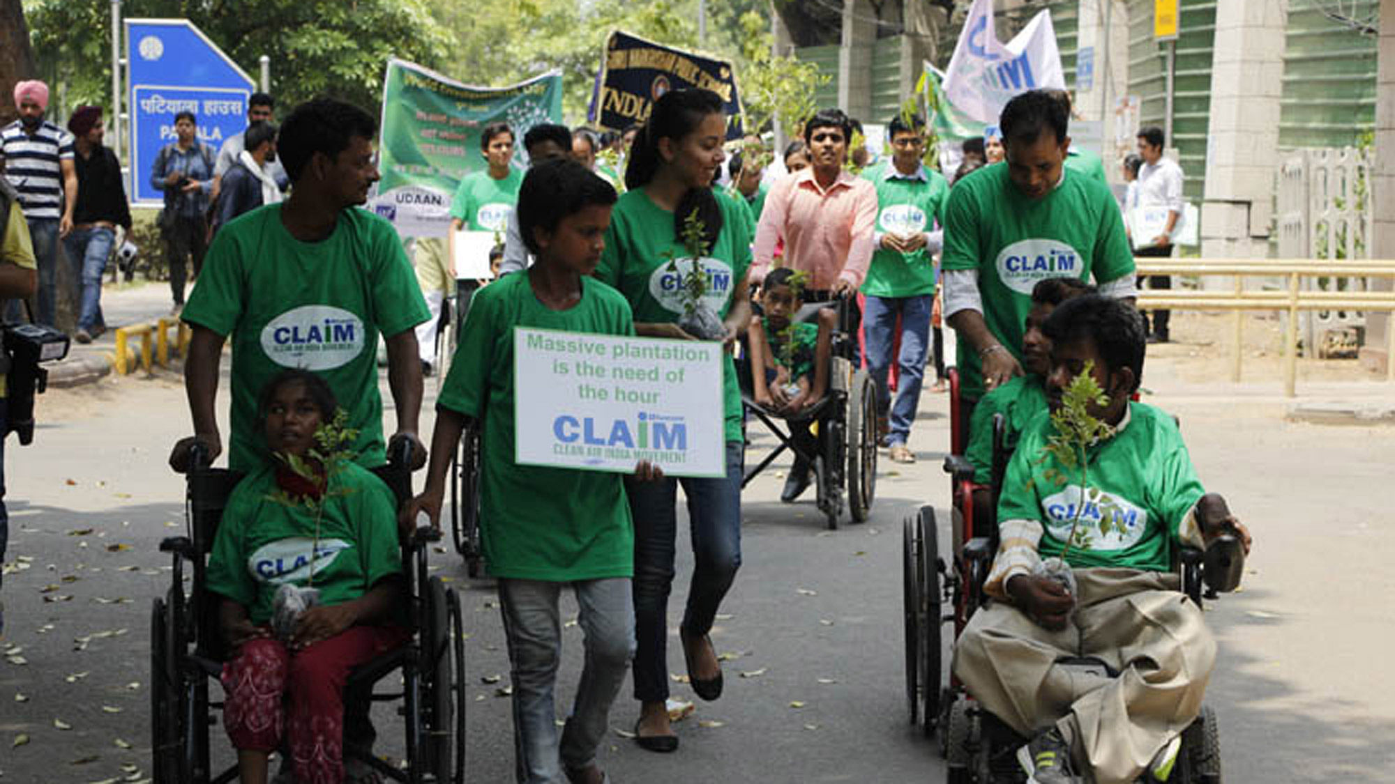 Differently abled students participating in a plantation drive on the occasion of World Environment Day. (Photo: IANS)