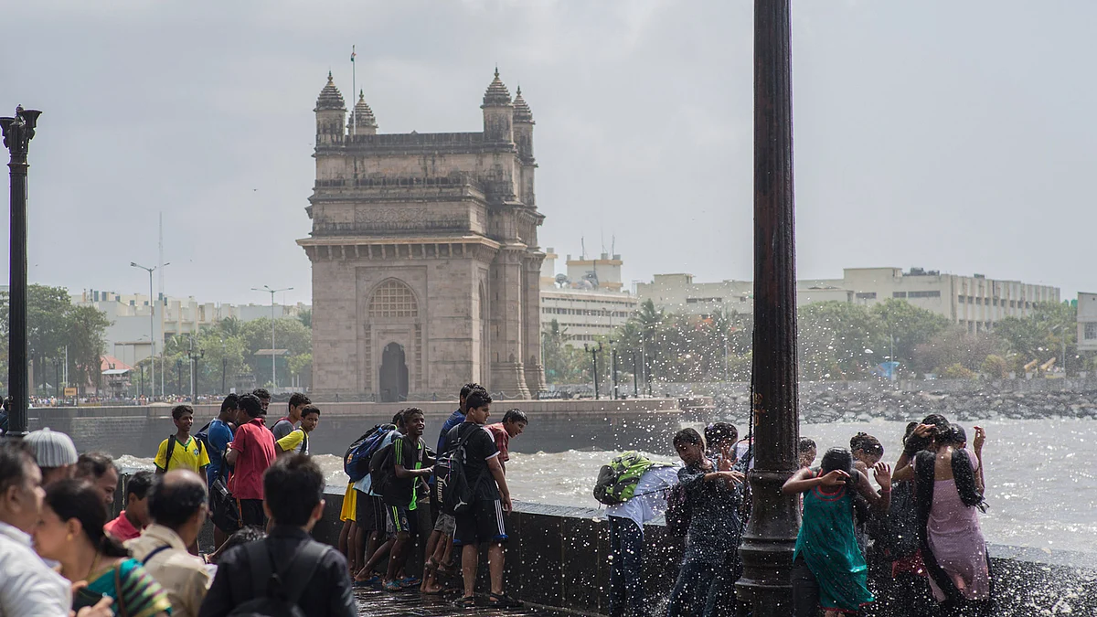 People enjoying rain near the Gateway of India. (Photo: iStockphoto)