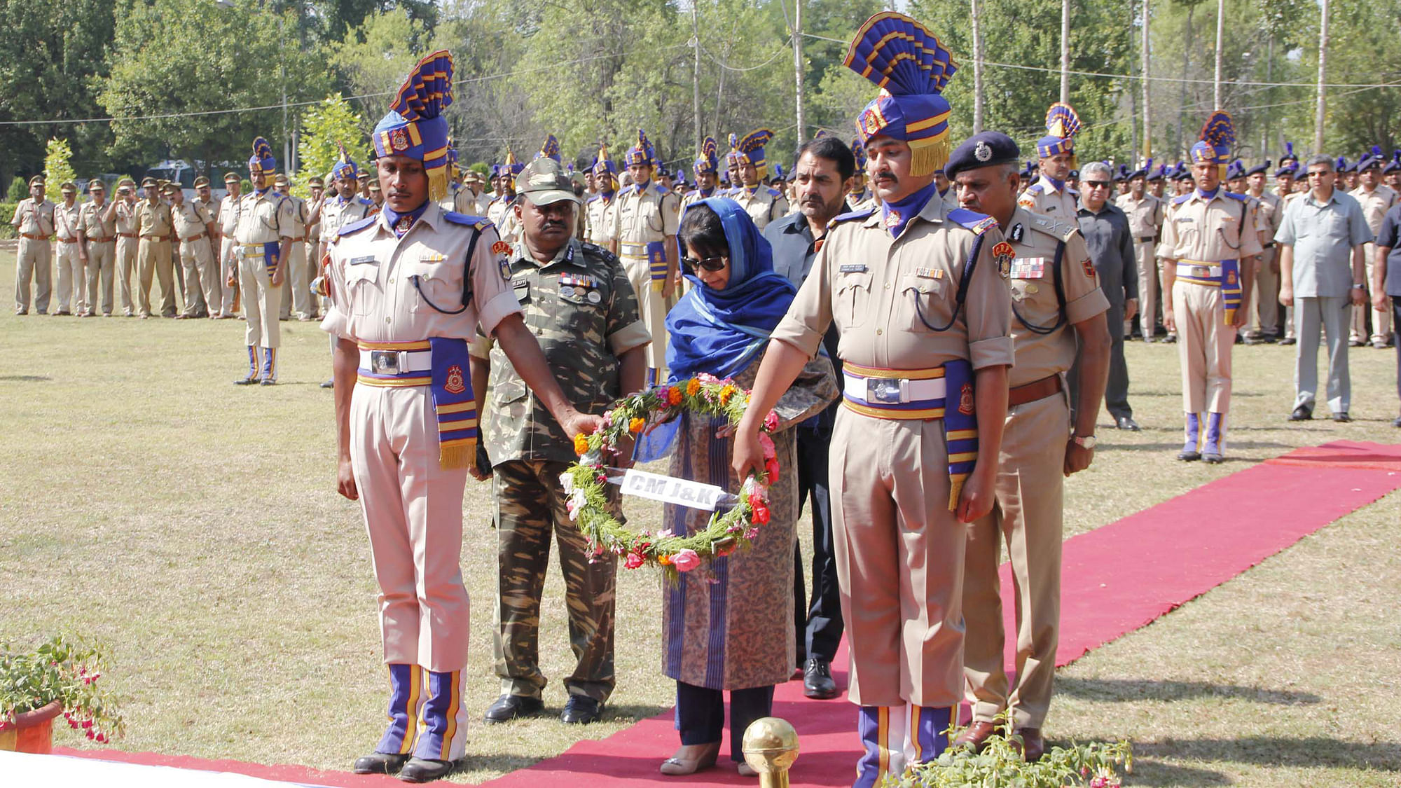 Jammu &amp; Kashmir Chief Minister Mehbooba Mufti lays wreath at the coffins of CRPF martyrs. (Photo: IANS)