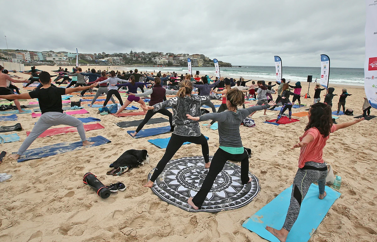 Australians performing yoga postures. (Photo: AP)