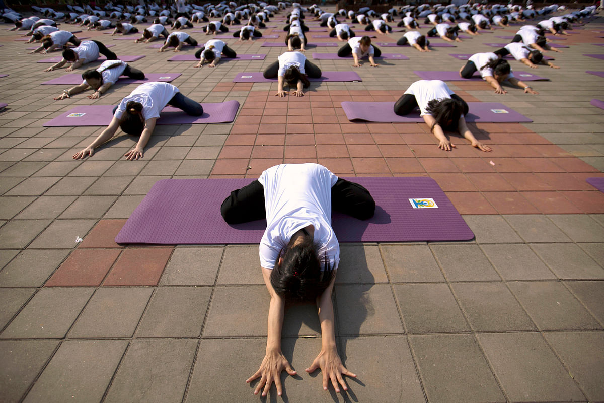 All the madness, energy, and twists and turns that marked International Yoga Day in different countries.
