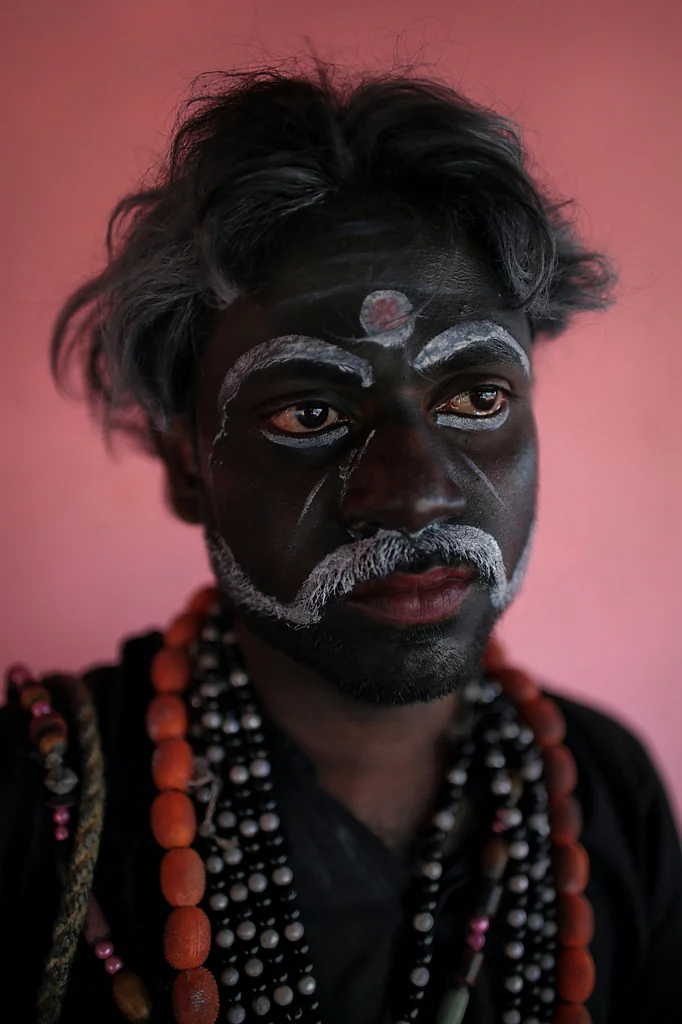 A dancer from the Gaarudi Gombe Kunitha tradition playing the evil demon Ravan, poses for a portrait in Karnataka. (Photo: Souvid Datta)