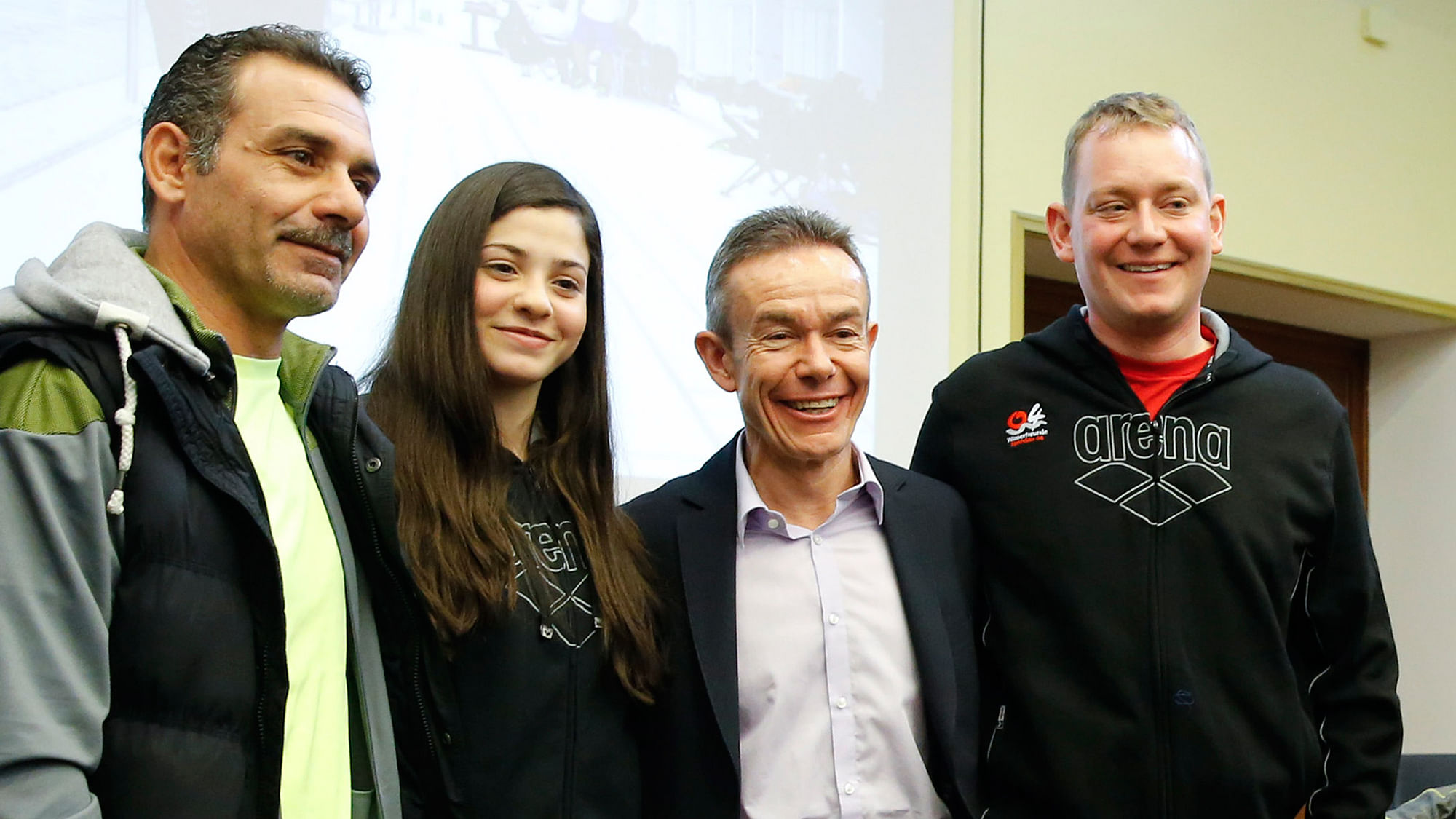 Syrian swimmer Yusra Mardini, her father Izzet (left) Pere Miro (2nd right) Deputy Director General for Relations with the Olympic Movement at the International Olympic Committee (IOC) and coach Sven Spannekrebs (right) of Wasserfreunde Spandau 04  in Berlin, Germany. (Photo: Reuters/Fabrizio Bensch)