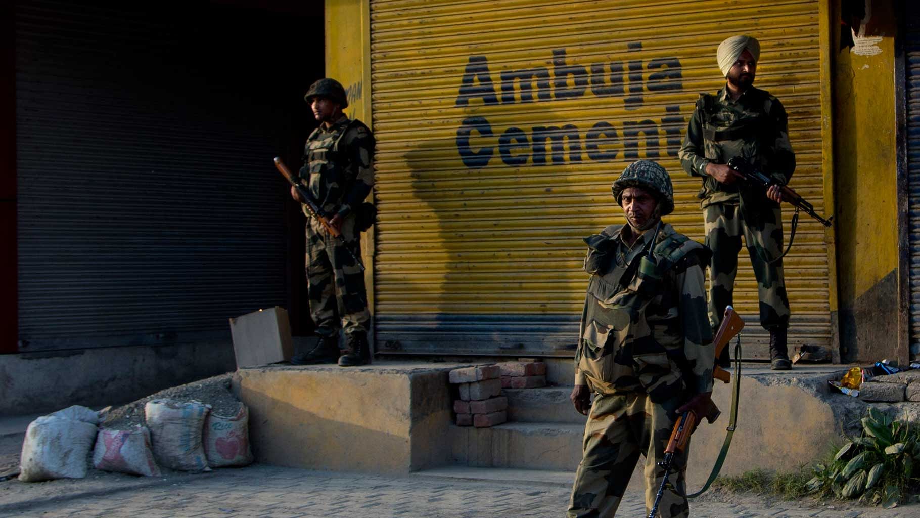 Indian Border Security Force (BSF) personnel stand guard near the site of an ambush in Srinagar. Photo used for representational purpose. (Photo: AP)