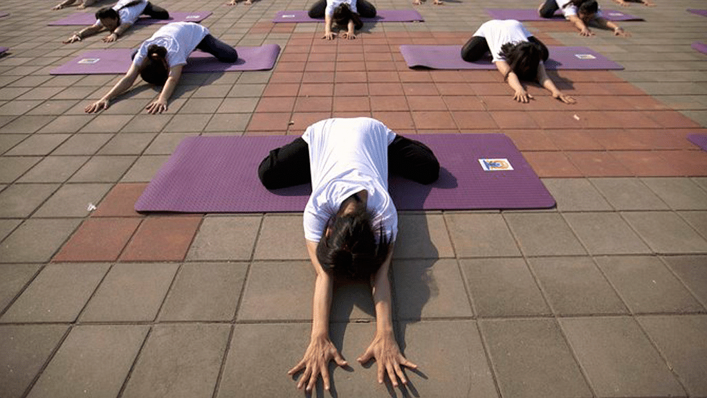 Yoga <i>asanas</i> being performed in China. (Photo: AP)