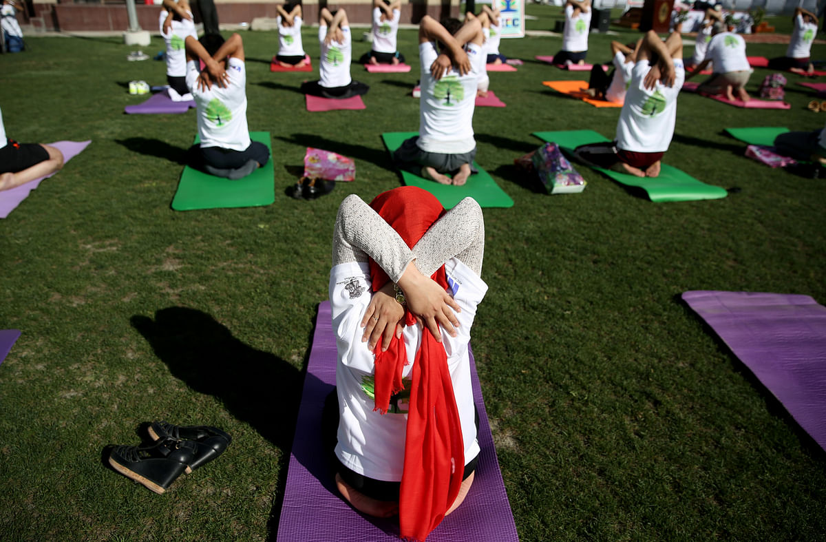 All the madness, energy, and twists and turns that marked International Yoga Day in different countries.