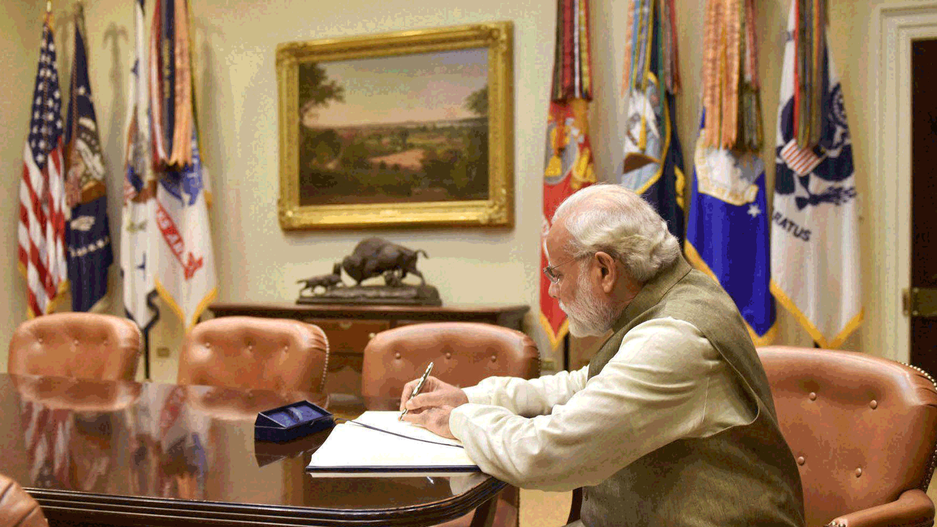 Prime Minister Narendra Modi signing the visitors’ book  at White House. (Photo: PTI)