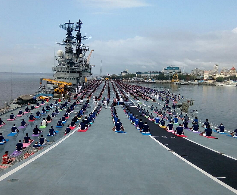 Navy personnels doing yoga onboard aircraft carrier INS Viraat. (Photo: ANI)