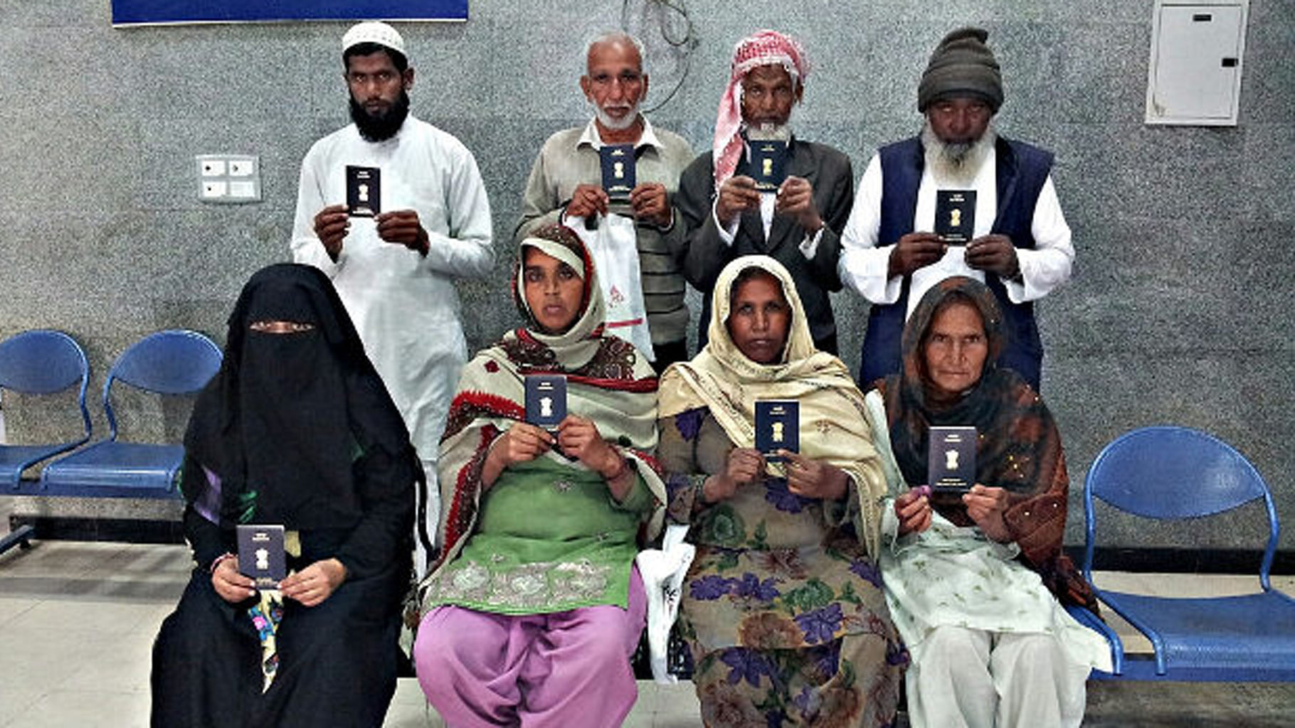 Indian citizens display their passports during a special drive held for Haj applicants at Regional Passport Office, Chandigarh, in 2014.&nbsp;