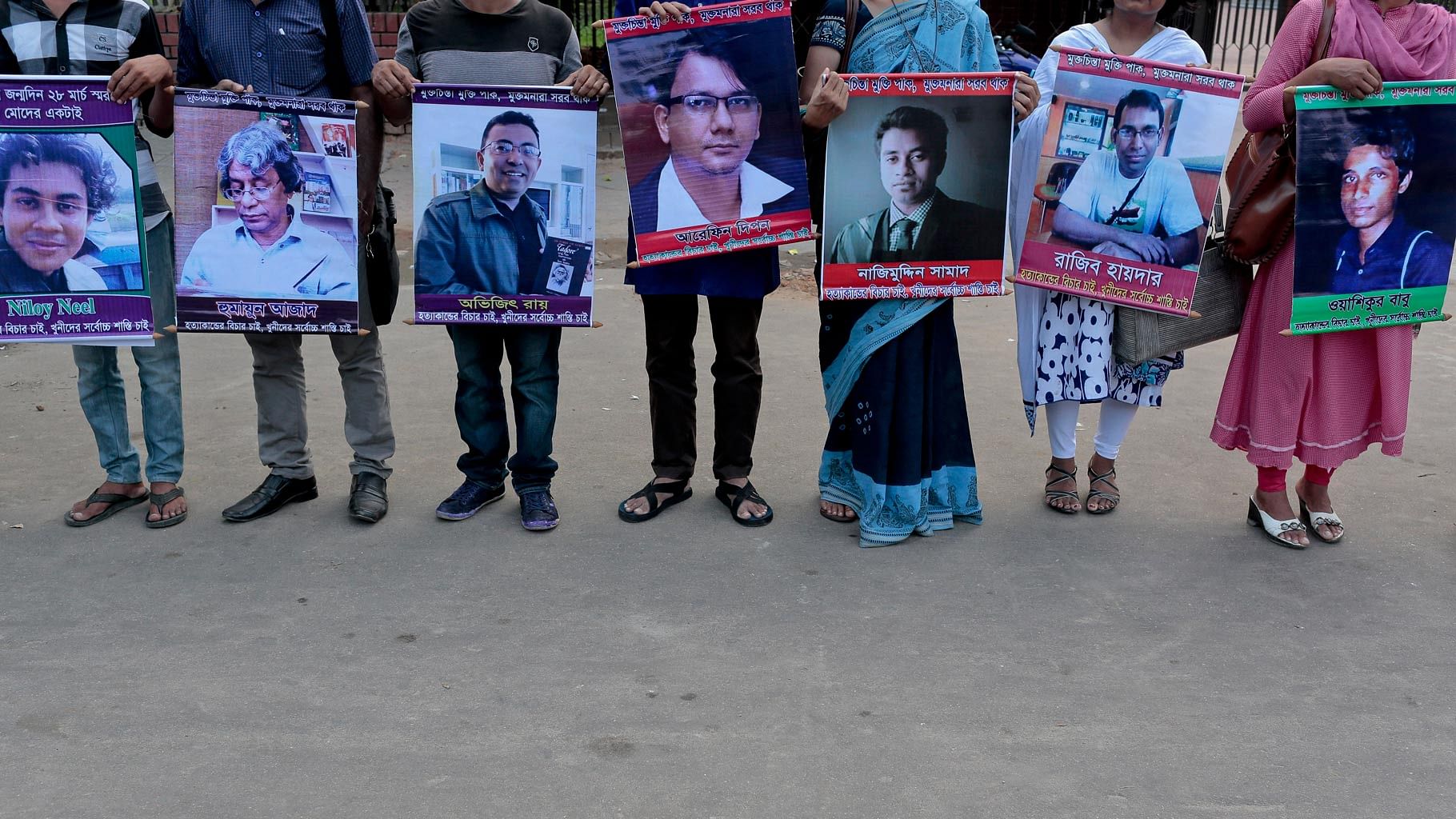 Bangladeshi social activists hold portraits of those hacked to death in the last few year in Bangladesh. (Photo: AP)