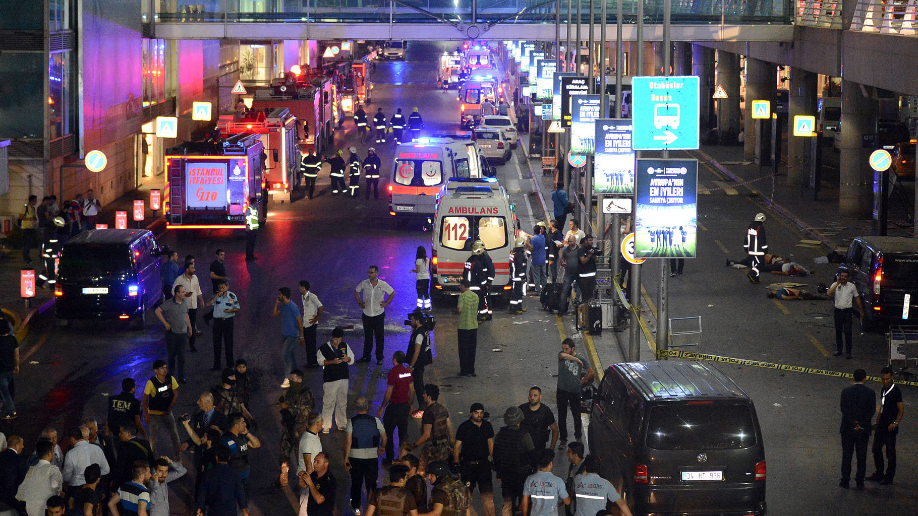 Medics and security members work at the entrance of the Ataturk Airport after explosions in Istanbul, on Tuesday. (Photo: AP)