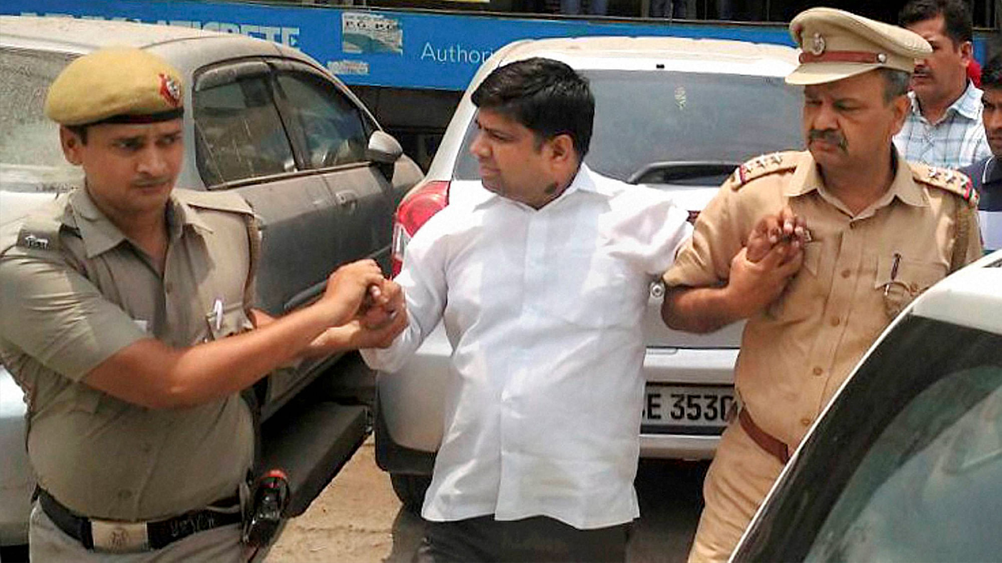 Police detain AAP MLA Dinesh Mohaniya in New Delhi on Saturday for allegedly misbehaving with a group of women who had gone to him to complain about water crisis. (Photo: PTI)