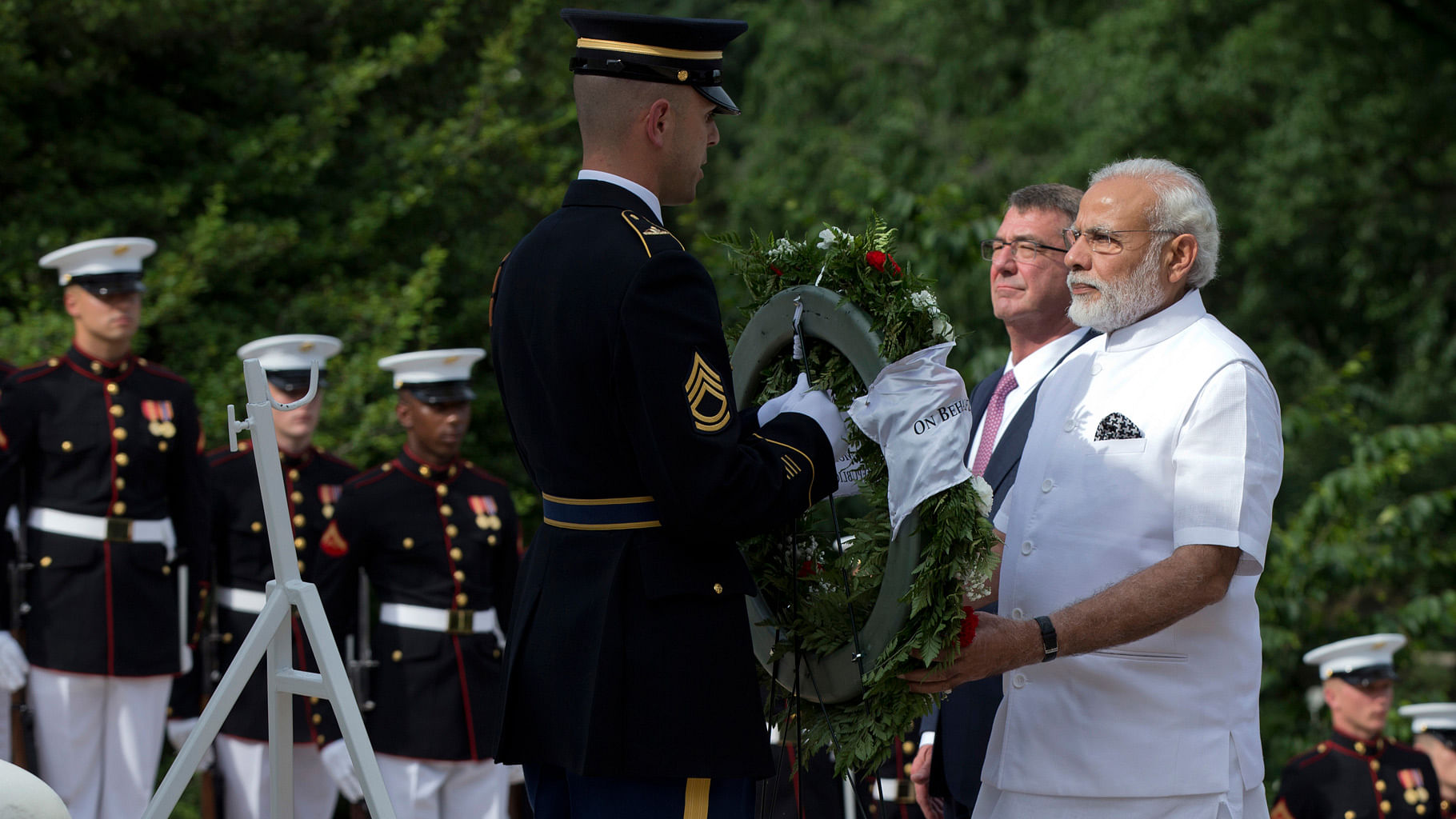

Narendra Modi, right, with Secretary of Defense Ash Carter, right of Modi, lays a wreath at the Tomb of the Unknowns at Arlington National Cemetery in the US on Monday, 6 June 2016. (Photo: AP)