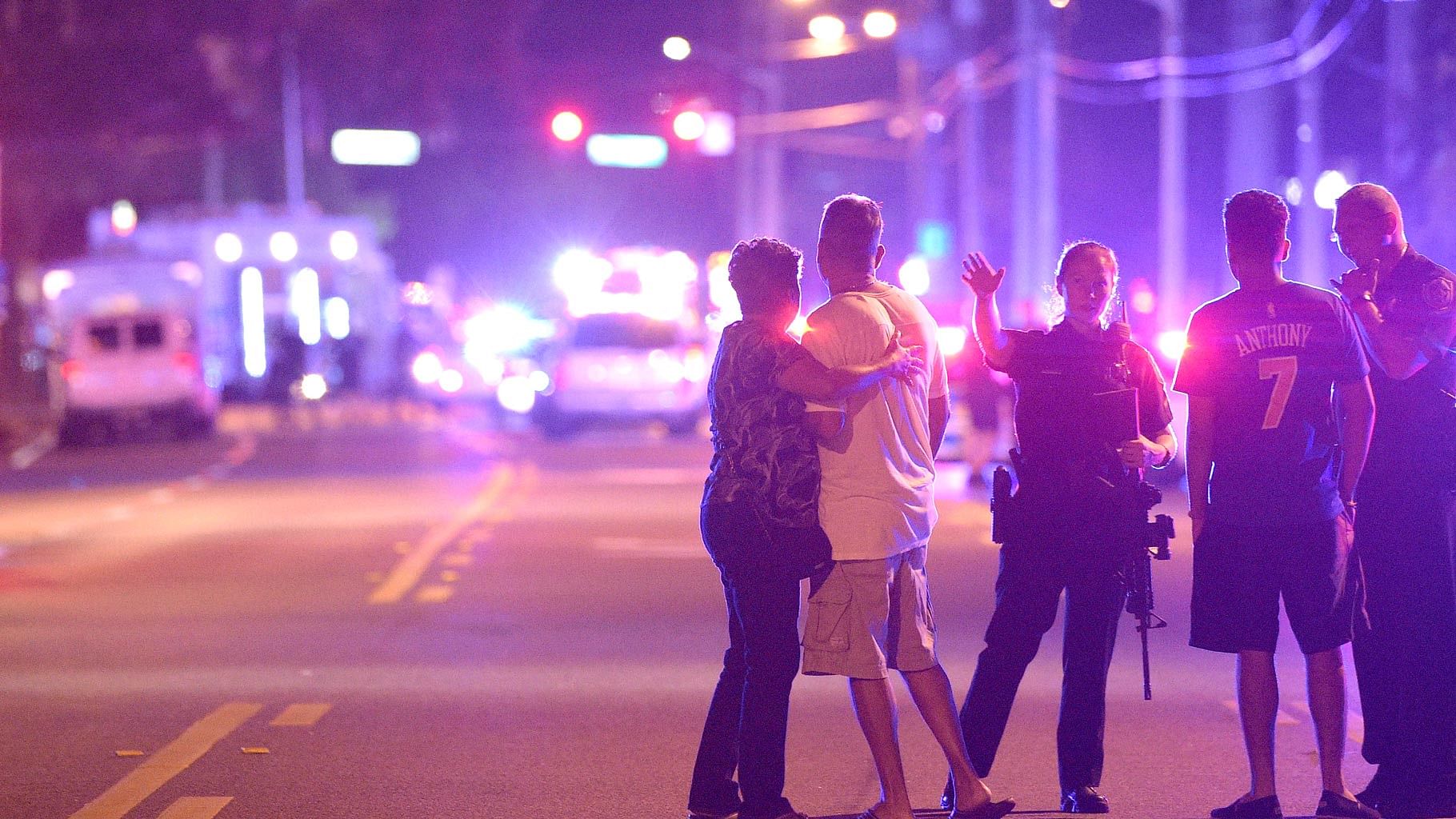 Orlando Police officers direct family members away from a multiple shooting at a nightclub in Orlando. (Photo: AP)