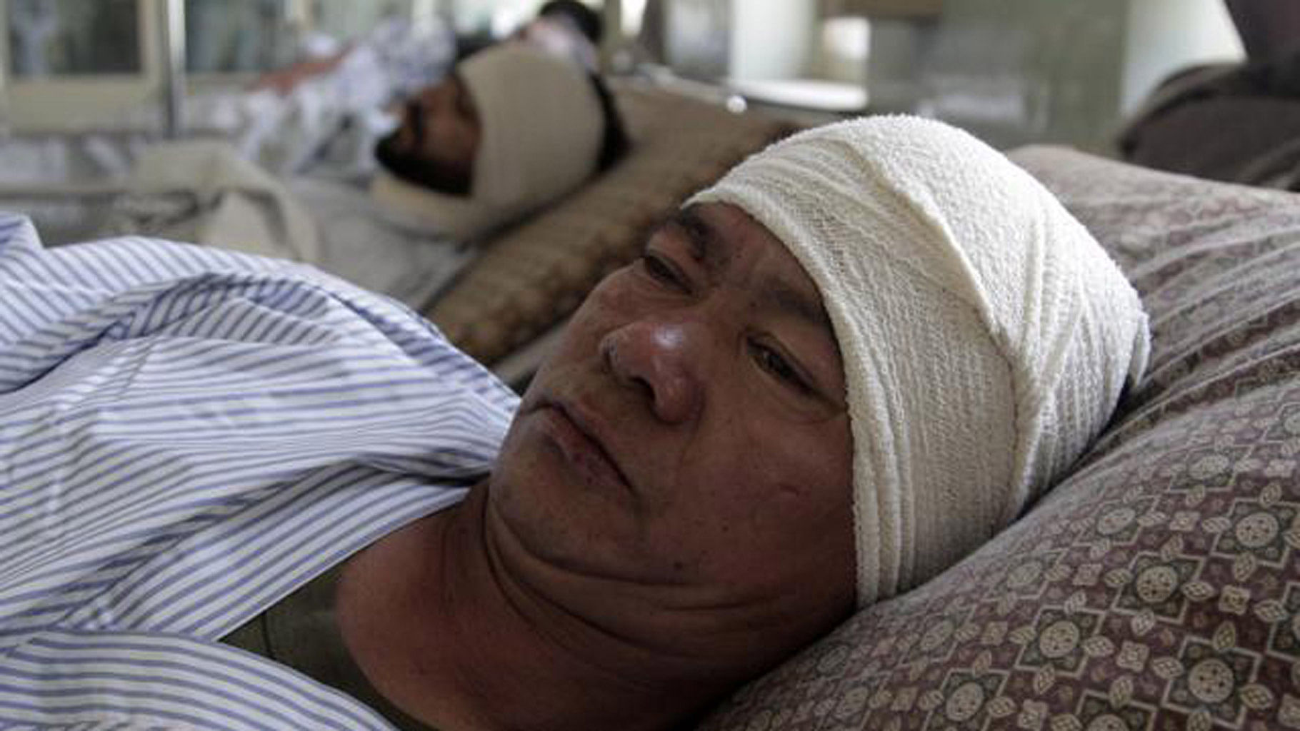 A Nepalese security guard receives treatment at a hospital in Kabul on 20 June. (Photo: AP)