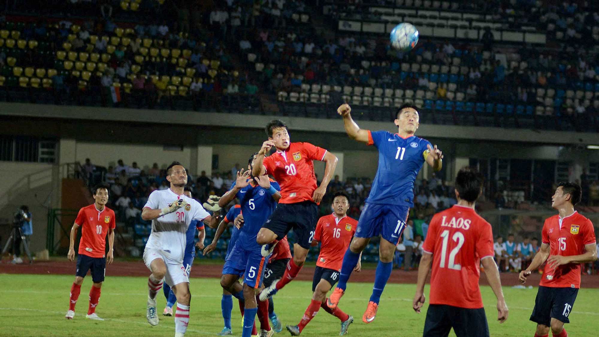 Guwahati : Players in action the match between India (Blue) and Laos (red) at AFC Asian Cup UAE 2019 (Qualifiers Pay-off Round) at Indira Gandhi Athletic Stadium in Guwahati (Photo: PTI)
