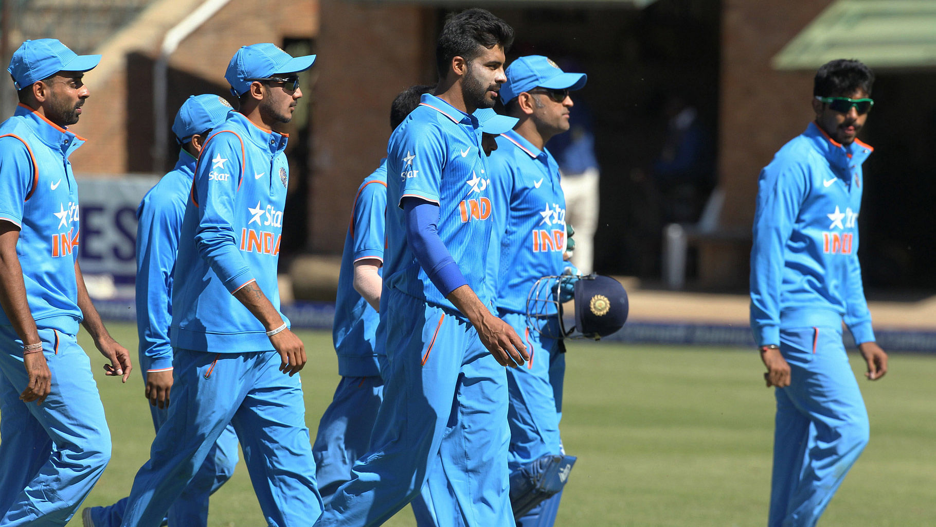 The Indian cricket team leaving the pitch after the end of their innings in the India-Zimbabwe ODI. (Photo: AP)