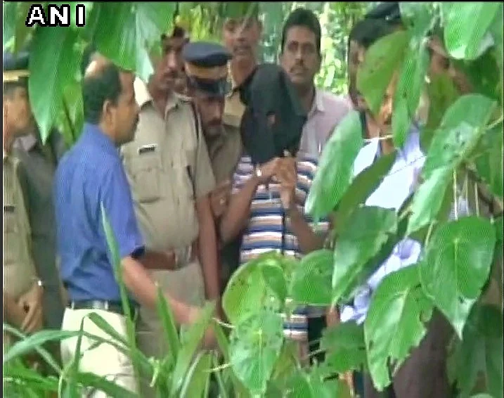 Accused surrounded by police. (Photo: ANI)