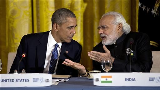 President Barack Obama talks with Prime Minister Narendra Modi during a working dinner with heads of delegations of the Nuclear Security Summit. (Photo: AP)