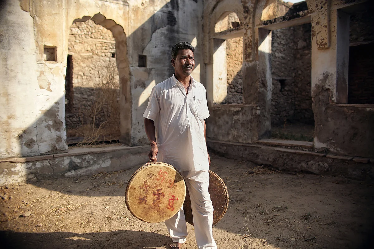 A rural musician holds up traditional Nagarra drums in Savatri village, Rajasthan. (Photo: Souvid Datta)