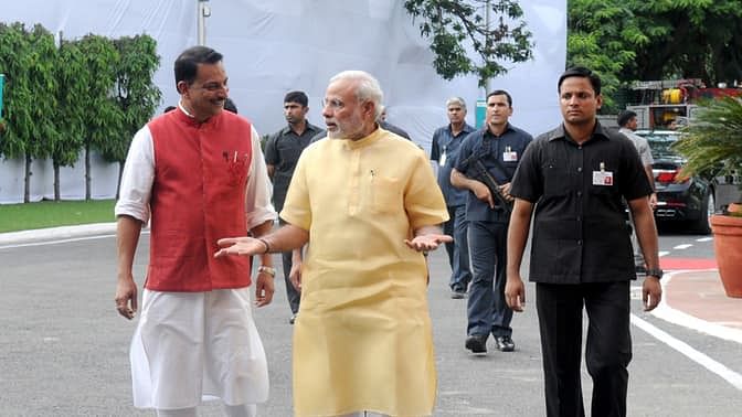 Prime Minister Narendra Modi with Minister of Minister of State for Skill Development &amp; Entrepreneurship Rajiv Pratap Rudy. (Photo Courtesy: PIB)