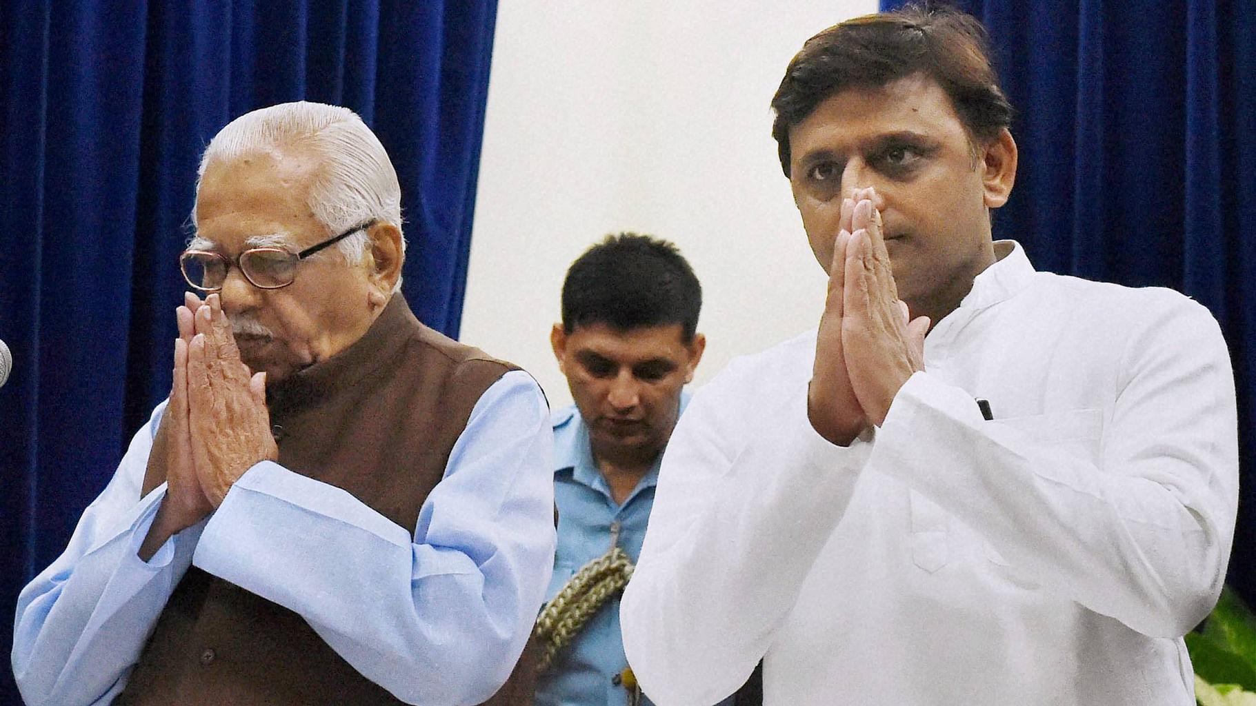 Uttar Pradesh Governor Ram Naik and state Chief Minister Akhilesh Yadav during the swearing in ceremony at Rajbhawan, in Lucknow on Monday. (Photo Courtesy: PTI)