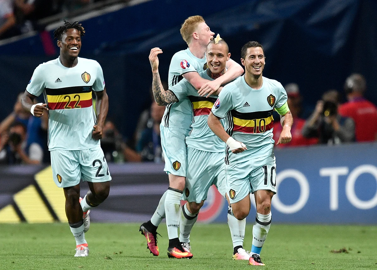 Belgium’s Eden Hazard, right, celebrates with team mates after scoring his side’s third goal during the Euro 2016 round of 16 match between Hungary and Belgium. (Photo: AP)
