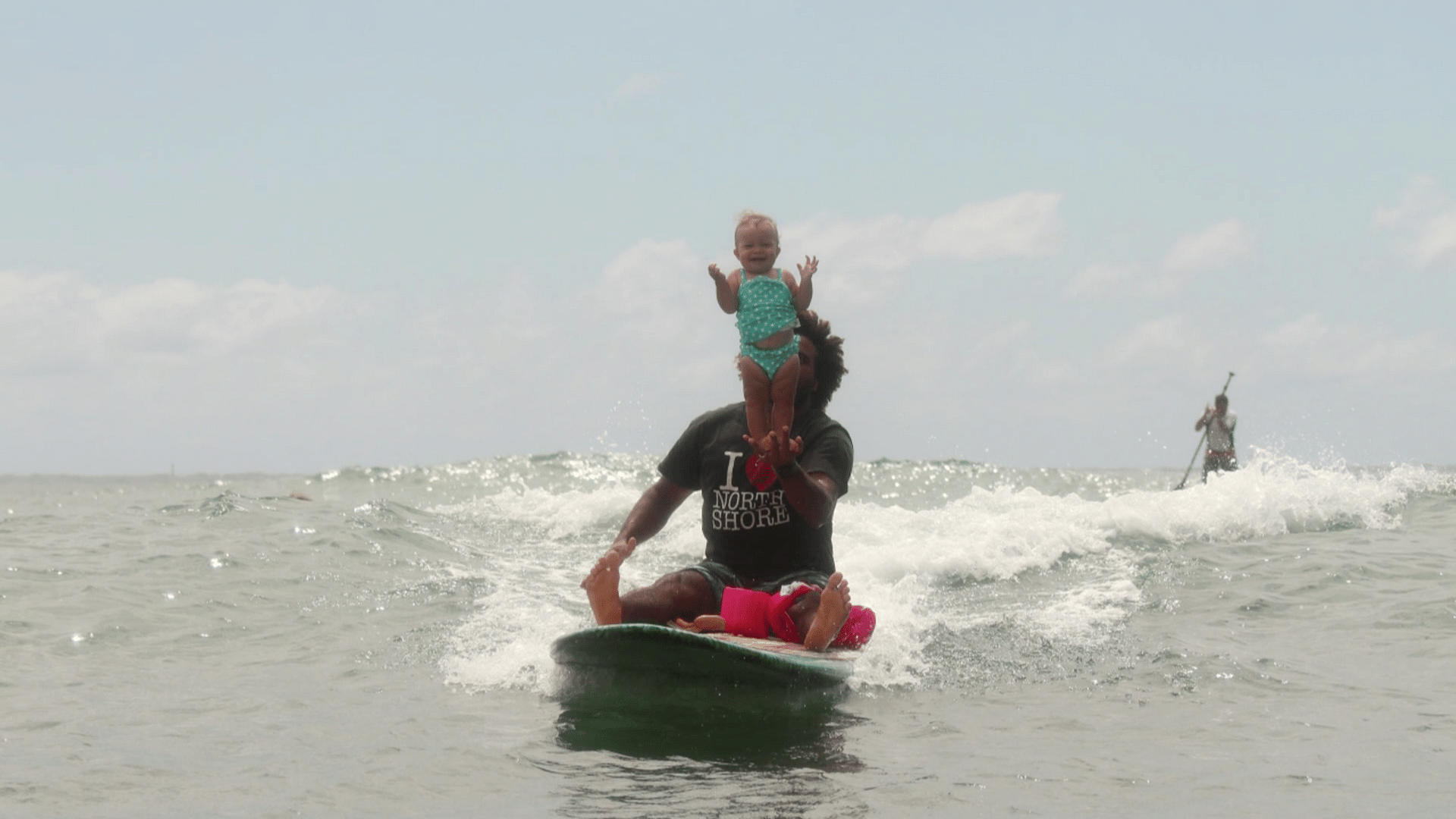 Hadassah, a nine-month-old surfer and her father Sergio. (AP Screengrab)