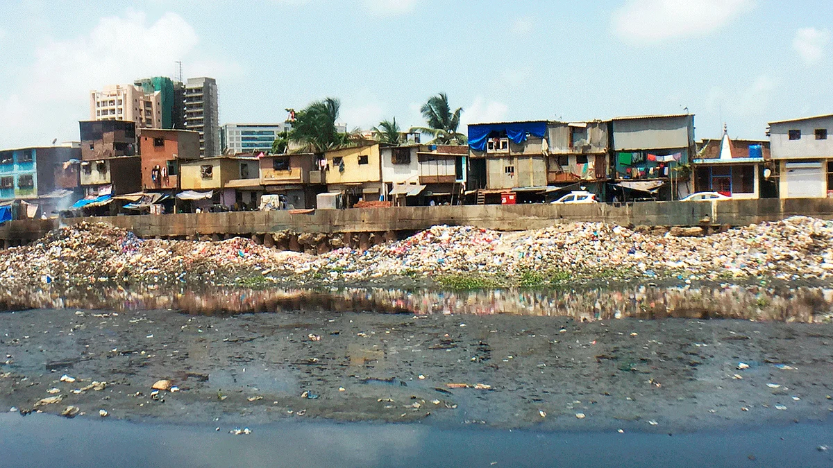 Gyaneshwar Nagar slum plot in Bandra (East) from across the Mithi river. 