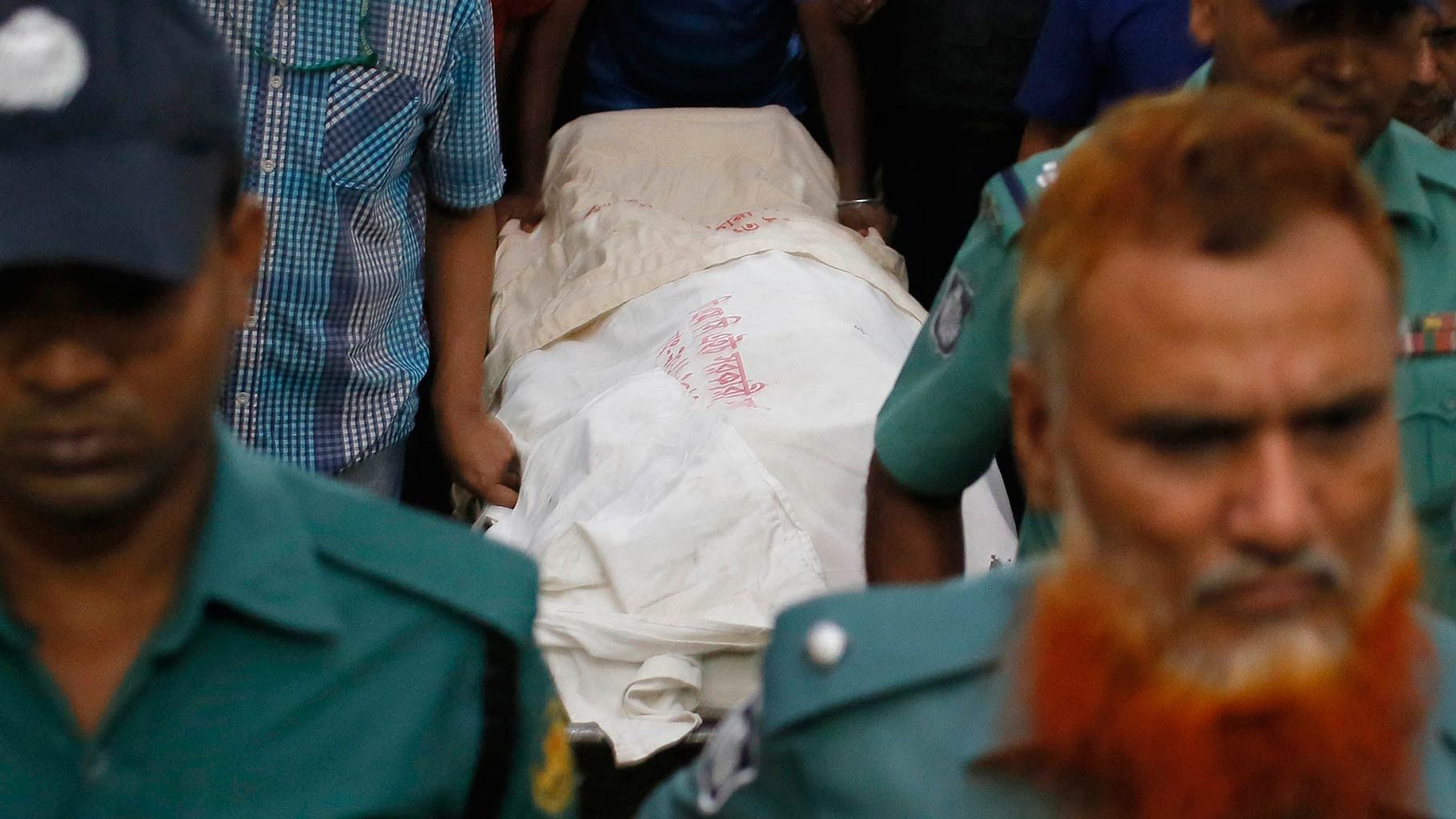 The body of book publisher Faisal Arefin Deepan is carried on a stretcher at Dhaka Medical College Hospital in October 2015. (Photo: AP)